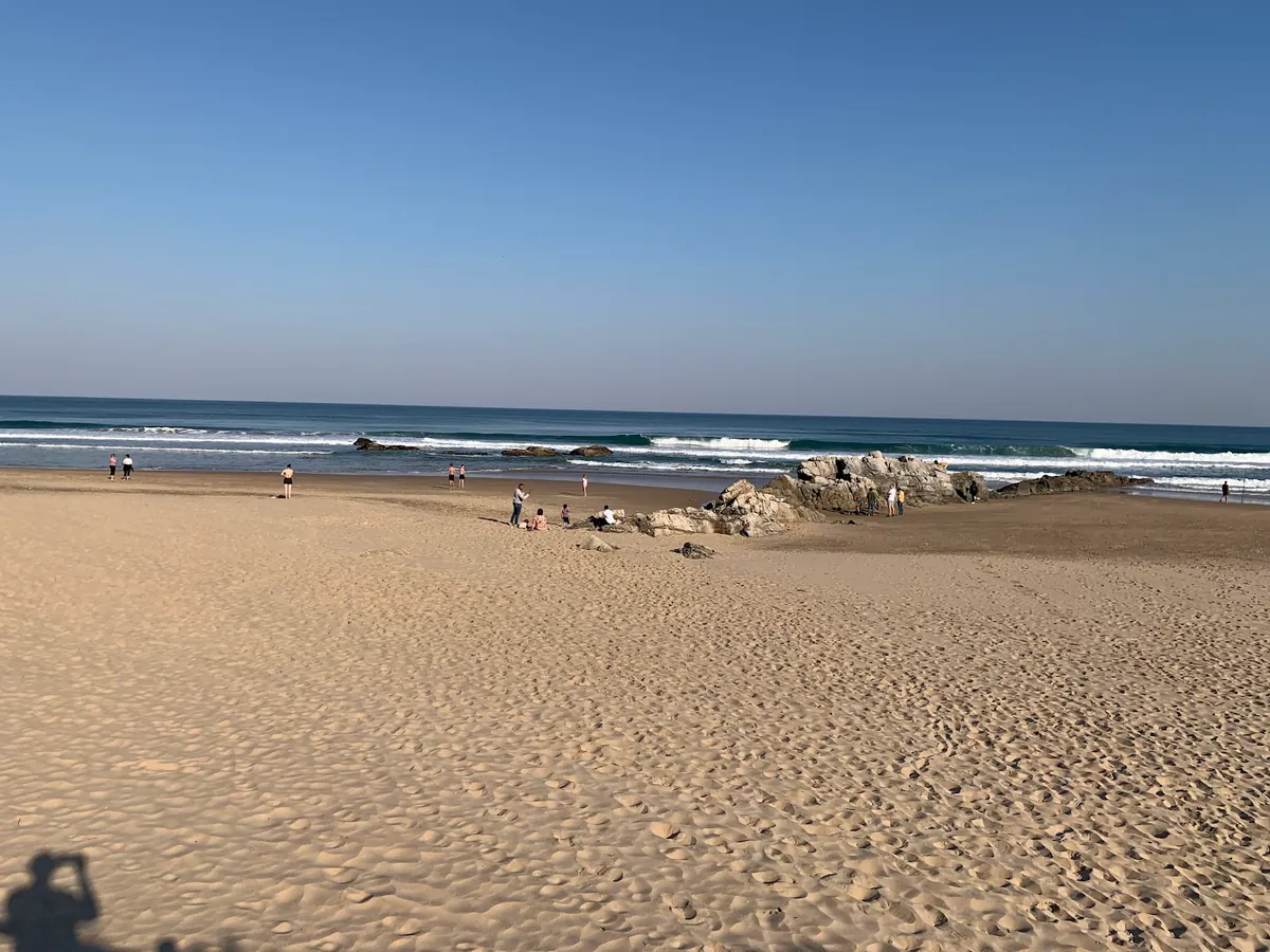 Wilderness Beach on the Garden Route — a wide sandy Blue Flag beach backed by forested hills
