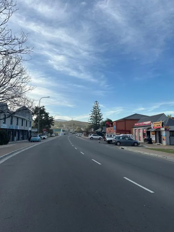 Town street with mountains and sky, scenic Garden Route location