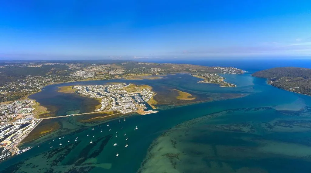 Aerial view of Knysna Heads with turquoise lagoon waters and sailboats