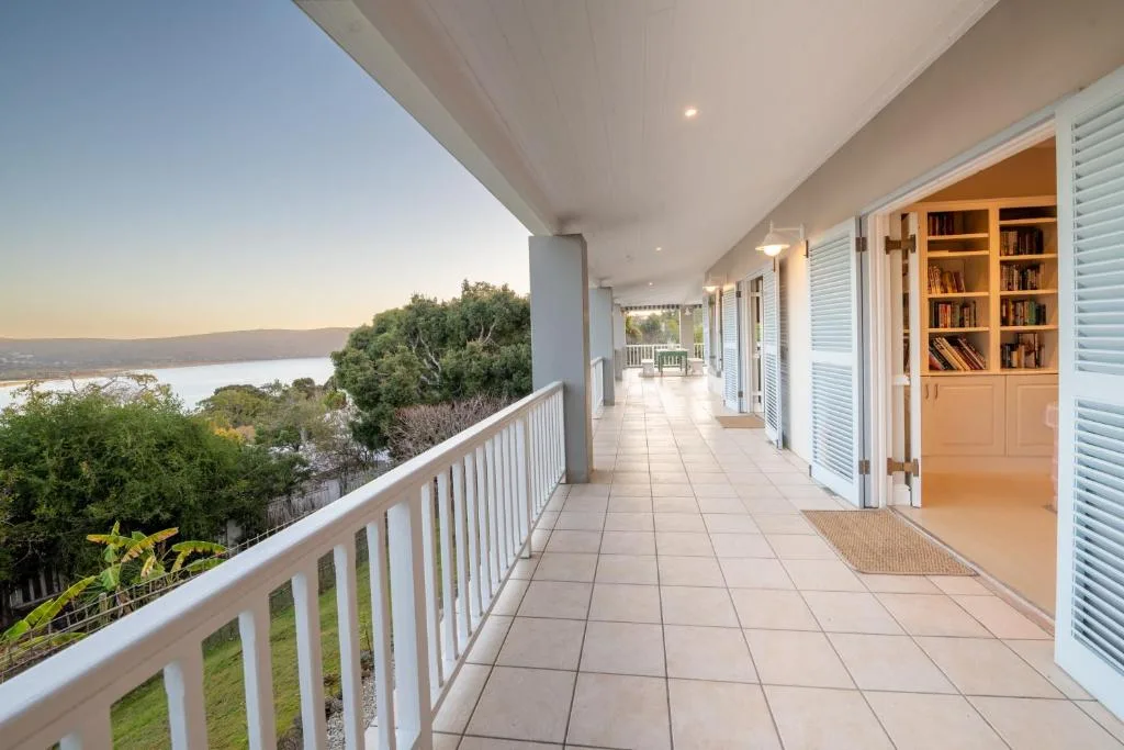 Spacious covered deck with lagoon views and built-in bookshelves