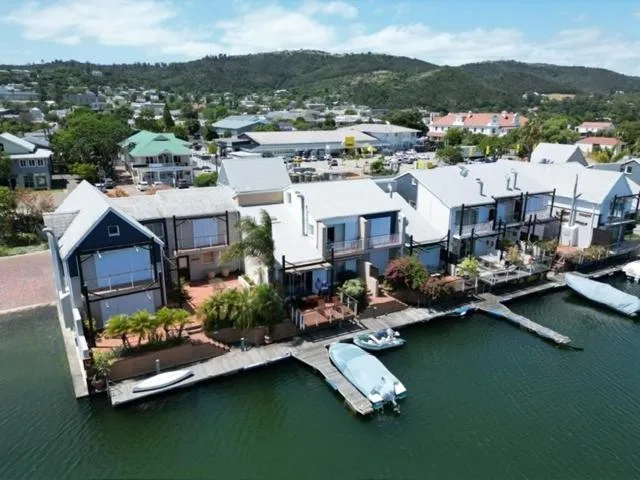 Waterfront row houses with private moorings and mountain views