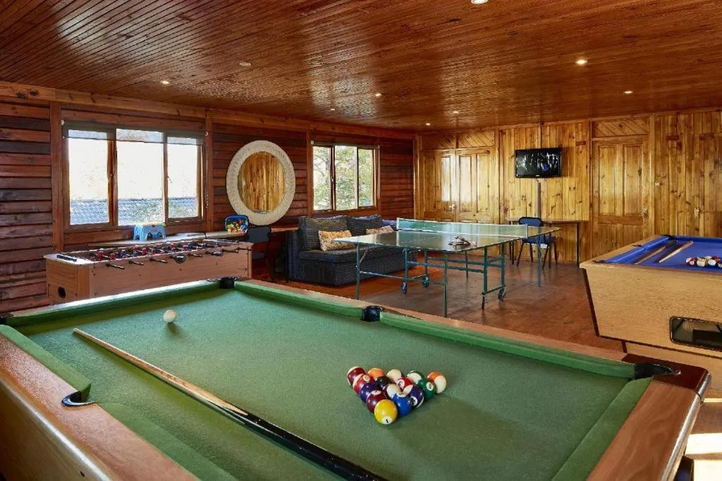 Games room with pool table, foosball, ping pong, and river views