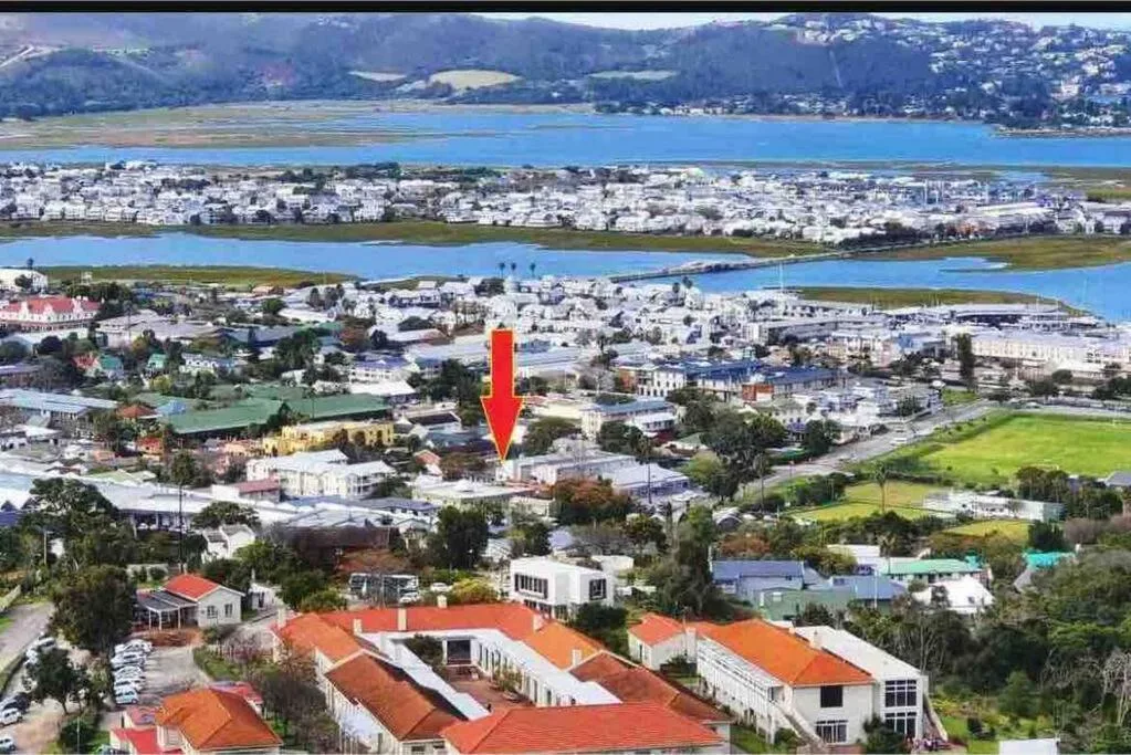 Aerial view of Knysna town nestled between sparkling lagoons and green hills