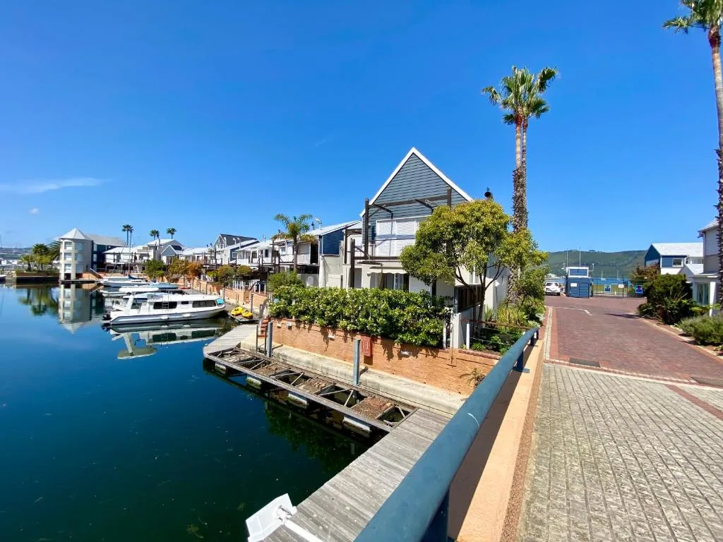 Waterfront property with modern architecture overlooking Knysna lagoon and boats