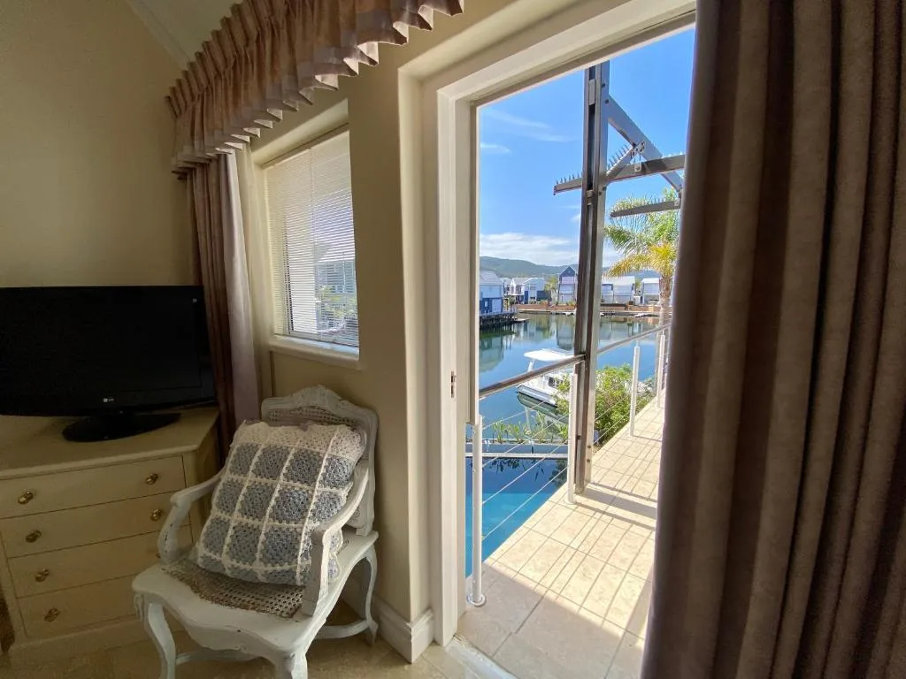 Waterfront view of Knysna lagoon and mountains from bedroom windows