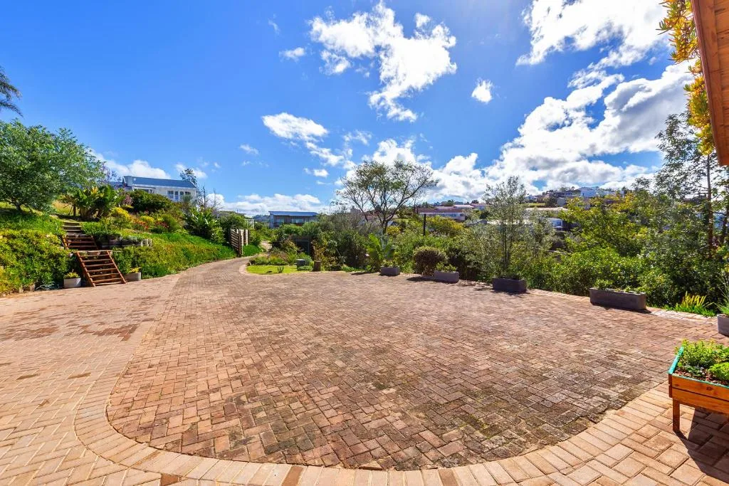 Spacious brick patio with garden landscaping and countryside views