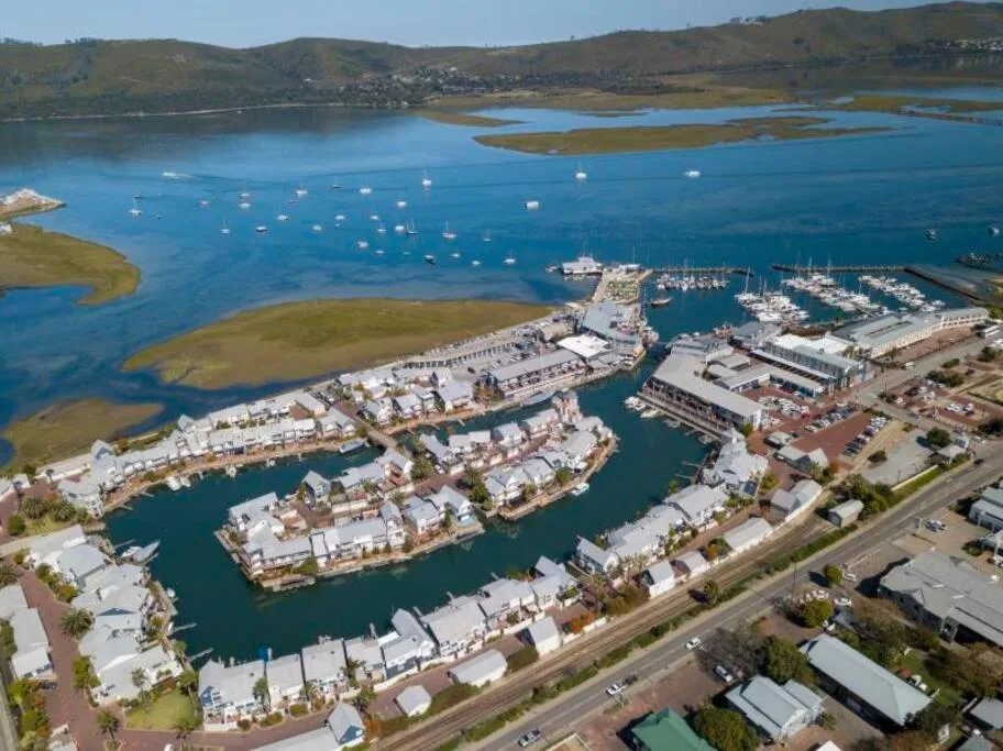 Aerial view of Knysna Heads with waterfront properties and marina