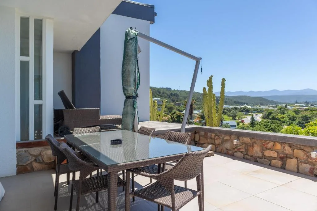 Elevated outdoor dining area with mountain and valley views beyond