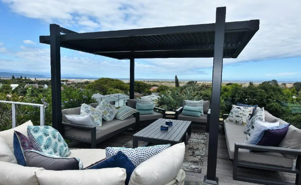 Modern outdoor deck with lounge seating and panoramic garden route views