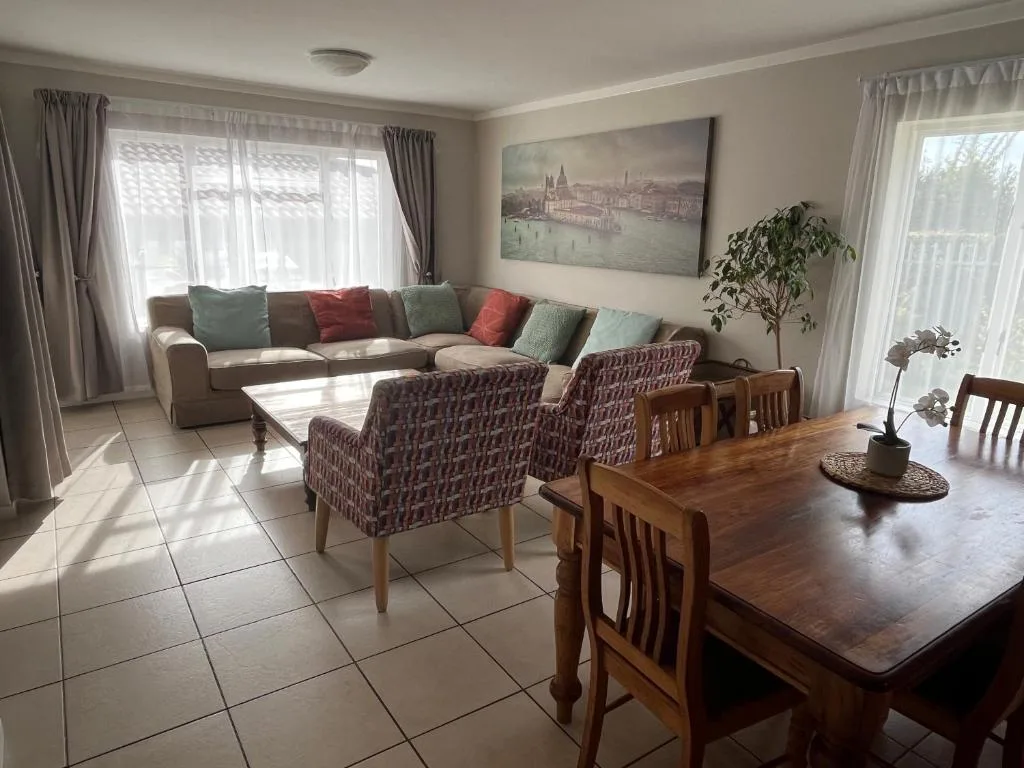 Spacious open-plan lounge and dining area with comfortable seating