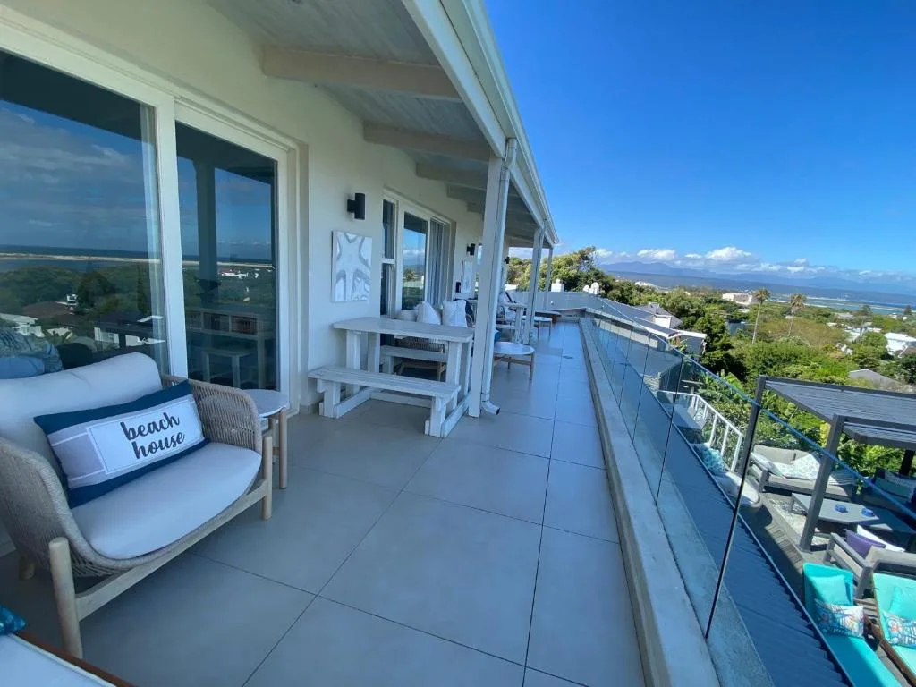 Spacious elevated deck with seating, ocean and mountain views