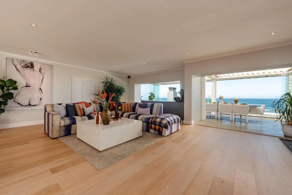 Spacious modern lounge with ocean views through large sliding doors