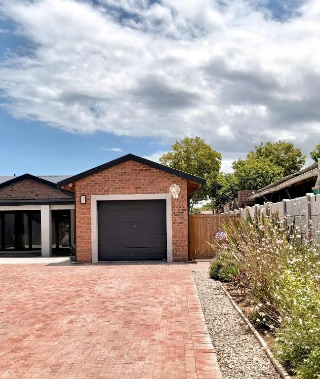 Modern brick holiday home with garage and paved driveway in Sedgefield
