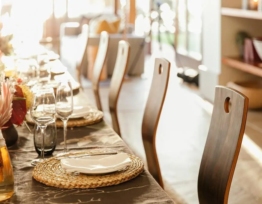 Elegant dining table set with place settings and wine glasses
