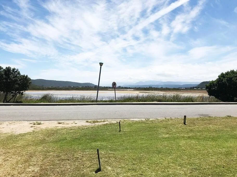 Scenic lagoon and mountain vista from property grounds