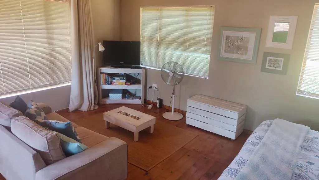 Spacious living room with comfortable seating and entertainment setup