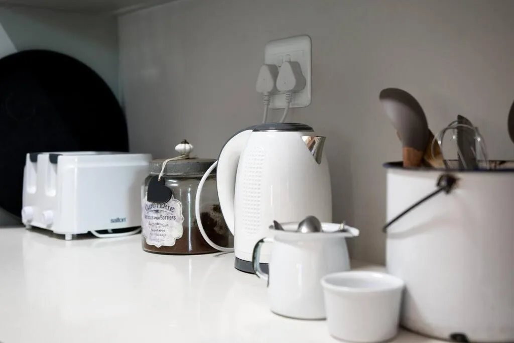 White electric kettle and coffee making appliances on kitchen counter