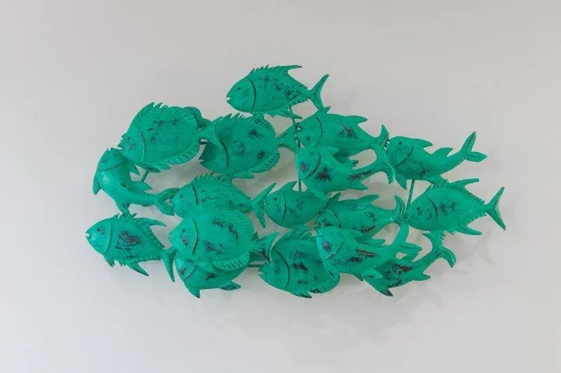 Turquoise fish-shaped wall art decoration in coastal theme style