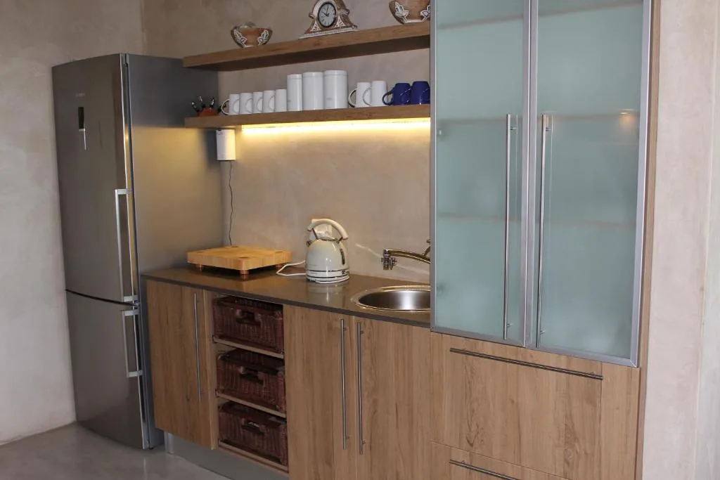 Modern kitchen with stainless steel appliances and wooden cabinetry